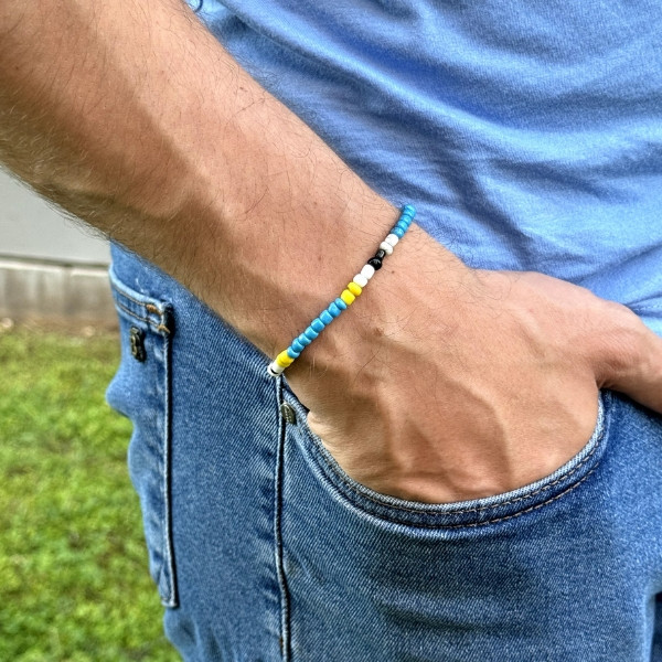 A Colorful Beaded Bracelet, Handmade by Iraqi Artisans, Inspired by The Colors of The Ishtar Gate.